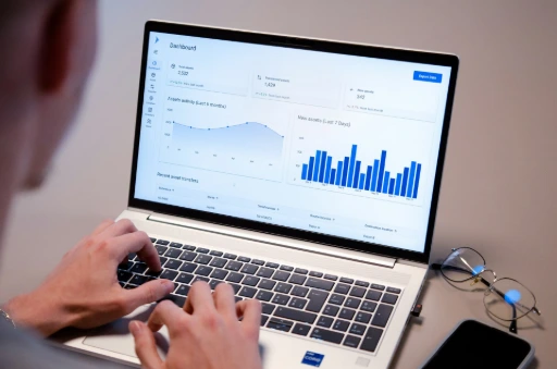 Person analyzing digital marketing data and ad performance on a laptop